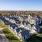 Drone shot of cottage home and apartment community
