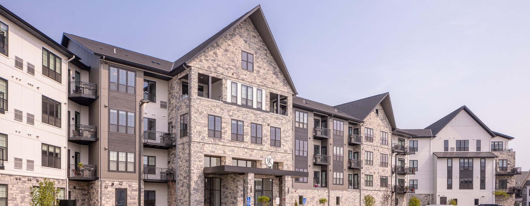 Front of large buildings with parking spaces in the front