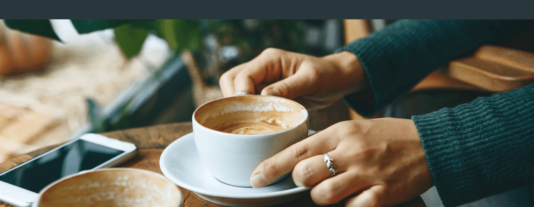 hands holding a coffee cup